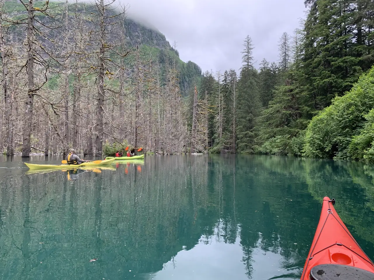 Blue Lake's teal water with moody mountain backdrop